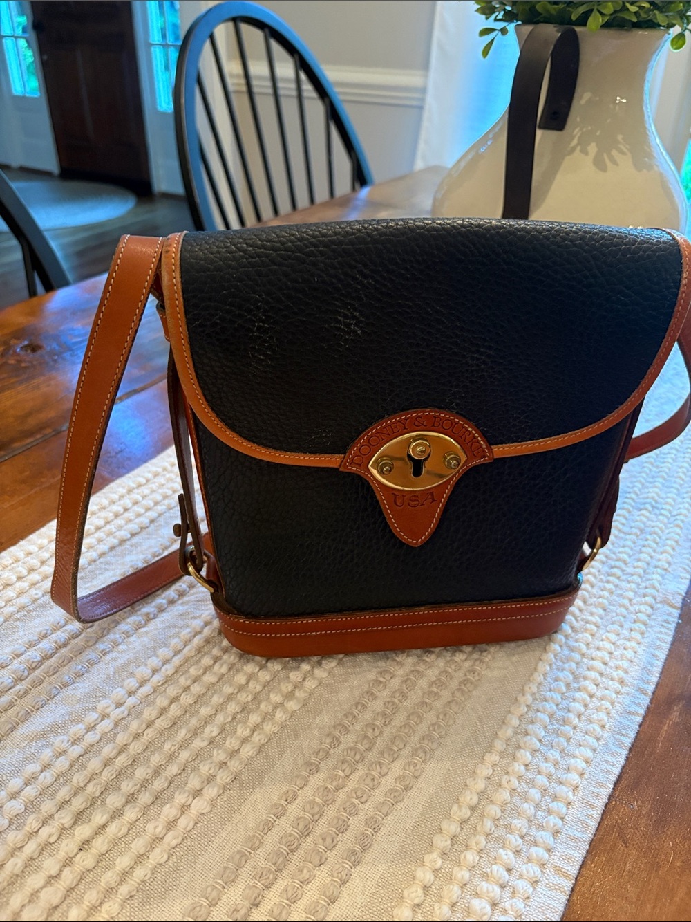 Dooney & Bourke Black with Brown Trim Pebbled Leather Messenger